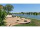 Well landscaped backyard with direct lake views offers the best in outdoor living at 9511 Sw 71St Loop, Ocala, FL 34481