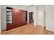 This bedroom has laminated floors and storage shelves with sliding mirrored doors at 9511 Sw 71St Loop, Ocala, FL 34481