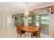 Dining room with a chandelier, a wooden table and a lake view at 9511 Sw 71St Loop, Ocala, FL 34481