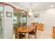 Dining room with a chandelier, a wooden table and a lake view at 9511 Sw 71St Loop, Ocala, FL 34481