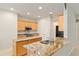 Kitchen with stainless appliances, granite countertops and an island perfect for entertaining at 9511 Sw 71St Loop, Ocala, FL 34481