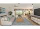 Bright living room with neutral tones, stylish decor and tile flooring at 9511 Sw 71St Loop, Ocala, FL 34481