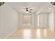 Spacious living room with neutral walls, tile flooring, ceiling fan and lots of natural light at 9511 Sw 71St Loop, Ocala, FL 34481