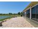Enjoy the beautiful lake view from the spacious brick paver patio of this home at 9511 Sw 71St Loop, Ocala, FL 34481