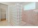 Shower featuring glass block wall, colored glass window, and stone bench seat at 9511 Sw 71St Loop, Ocala, FL 34481