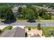 An aerial street view of a neighborhood, showcasing the lush landscaping and tranquil streets at 9511 Sw 71St Loop, Ocala, FL 34481