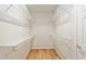 This walk-in closet is designed with white wire shelving for maximum storage at 9511 Sw 71St Loop, Ocala, FL 34481