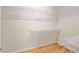 Spacious walk-in closet featuring white wire shelving and wood-look flooring at 9511 Sw 71St Loop, Ocala, FL 34481