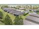 Scenic aerial shot showcases a home's screened lanai and lush green lawn, backing onto a street with sidewalks at 9658 Sw 76Th Lane Rd, Ocala, FL 34481