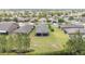 Expansive aerial view of a home with a well-maintained lawn and screened lanai within a vibrant residential community at 9658 Sw 76Th Lane Rd, Ocala, FL 34481