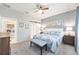 Cozy bedroom with a sliding barn door to the bathroom and convenient laundry room access at 9658 Sw 76Th Lane Rd, Ocala, FL 34481