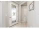 Bright entryway with tiled floors and decorative glass front door at 9658 Sw 76Th Lane Rd, Ocala, FL 34481
