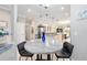 View of eat-in kitchen and kitchen showcasing white cabinetry, granite countertops, and stainless steel appliances at 9658 Sw 76Th Lane Rd, Ocala, FL 34481