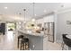 Open kitchen featuring stainless steel appliances, granite countertops, and island with seating at 9658 Sw 76Th Lane Rd, Ocala, FL 34481