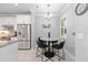 Eat-in kitchen features stainless steel appliances, stone countertops, and a chandelier at 9658 Sw 76Th Lane Rd, Ocala, FL 34481