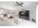 Open-concept living space with a built-in entertainment center and access to the kitchen at 9658 Sw 76Th Lane Rd, Ocala, FL 34481