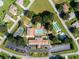 Aerial view of community amenities including a pool, tennis court, and recreation center with parking at 10016 Sw 62Nd Cir, Ocala, FL 34476