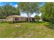 Picture of the home's expansive backyard, showcasing its well-maintained lawn at 10016 Sw 62Nd Cir, Ocala, FL 34476