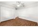 Large bedroom with ceiling fan, wood-look flooring, and a closet at 10016 Sw 62Nd Cir, Ocala, FL 34476