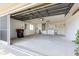 Spacious garage with laundry hookups, utility sink, storage cabinets, and ample space for parking and projects at 10016 Sw 62Nd Cir, Ocala, FL 34476