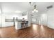 Open-concept kitchen with white cabinetry, stainless steel appliances, and bar seating at 10016 Sw 62Nd Cir, Ocala, FL 34476