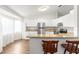Modern kitchen with white cabinets, granite countertops, and stainless steel appliances at 10016 Sw 62Nd Cir, Ocala, FL 34476