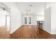 Living room with hardwood floors, French doors, and a bar area at 10016 Sw 62Nd Cir, Ocala, FL 34476