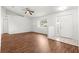 Open concept living area featuring laminate floors, fan and natural light at 10016 Sw 62Nd Cir, Ocala, FL 34476