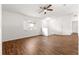 Open concept living area featuring laminate floors, fan and natural light at 10016 Sw 62Nd Cir, Ocala, FL 34476