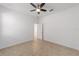 Bright bedroom featuring a ceiling fan, neutral walls, and tiled floor at 10277 Sw 96Th Loop, Ocala, FL 34481
