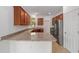 Well-equipped kitchen features granite countertops and stainless steel appliances at 10277 Sw 96Th Loop, Ocala, FL 34481