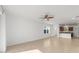 Spacious living room with tile flooring and an adjacent view of the kitchen at 10277 Sw 96Th Loop, Ocala, FL 34481