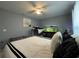 Functional bedroom with an aquarium, ceiling fan, and a mix of decor at 1100 Nw 126Th Ln, Citra, FL 32113