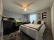 Functional bedroom with an aquarium, ceiling fan, and a mix of decor at 1100 Nw 126Th Ln, Citra, FL 32113