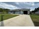 Attractive single-story home with an attached garage and a concrete driveway at 1100 Nw 126Th Ln, Citra, FL 32113