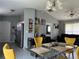 Bright and airy living space featuring tile flooring, dining area, and modern decor at 1100 Nw 126Th Ln, Citra, FL 32113