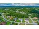 An aerial view showcases this home's location in a peaceful, tree-lined neighborhood at 11147 Sw 53Rd Cir, Ocala, FL 34476