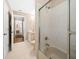 Bathroom featuring a tub shower, toilet, vanity, and an adjacent hallway at 11147 Sw 53Rd Cir, Ocala, FL 34476