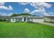 Well-manicured lawn and landscaping frame this attractive single-story home with an attached two car garage at 11147 Sw 53Rd Cir, Ocala, FL 34476