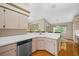 Bright kitchen area with light wood cabinets, stainless steel appliances, and hardwood floors at 11147 Sw 53Rd Cir, Ocala, FL 34476