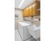 Practical laundry room with washer, dryer, utility sink, and ample cabinet space at 11147 Sw 53Rd Cir, Ocala, FL 34476