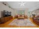 Spacious living room boasts hardwood floors, leather sofas, and plenty of natural light at 11147 Sw 53Rd Cir, Ocala, FL 34476