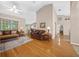 Expansive living room features hardwood floors, comfortable seating, and access to other rooms at 11147 Sw 53Rd Cir, Ocala, FL 34476