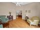 Comfortable living room features gleaming hardwood floors and vaulted ceilings at 11147 Sw 53Rd Cir, Ocala, FL 34476