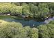 Beautiful overhead view of the river with lush surrounding trees and docks at 11170 Sw 190Th Ave, Dunnellon, FL 34432