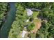Aerial view of a lovely home with river frontage surrounded by trees at 11170 Sw 190Th Ave, Dunnellon, FL 34432