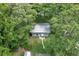 Aerial view of the charming home surrounded by lush greenery, showcasing its private and serene setting at 11170 Sw 190Th Ave, Dunnellon, FL 34432