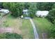Expansive aerial view showcases the property, complete with well-maintained lawn and driveway at 11170 Sw 190Th Ave, Dunnellon, FL 34432