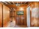 Unique bedroom with rustic wood accents and a view of the exterior through a large window at 11170 Sw 190Th Ave, Dunnellon, FL 34432