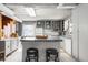 Bright kitchen with white cabinetry, central island, and stainless-steel appliances at 11170 Sw 190Th Ave, Dunnellon, FL 34432